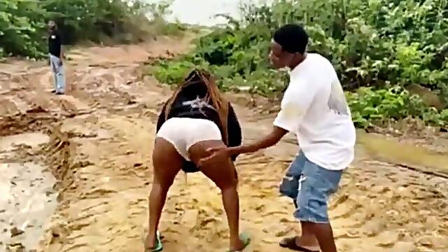 Busty babe shows off her wet and juicy ass at the beach