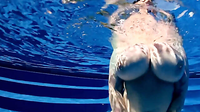 BBW babe shows off huge naturals in the pool underwater POV
