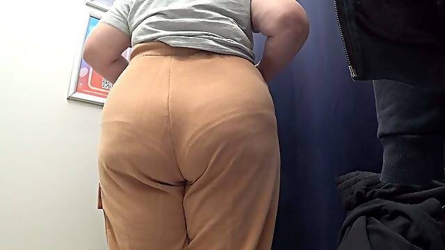 The camera in the fitting room watches a mature big ass in satin panties. Curvy milf changes clothes. PAWG