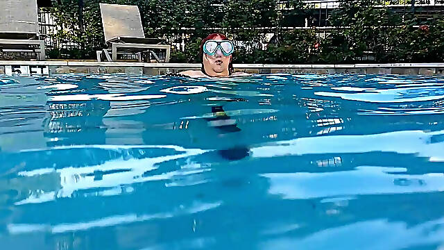 Couple Underwater Diving and Swimming